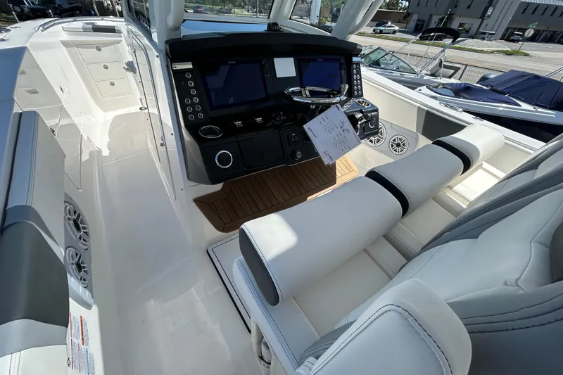  Yacht Photos Pics 2026 Robalo R360 Center Console boat interior with modern dashboard and seating.