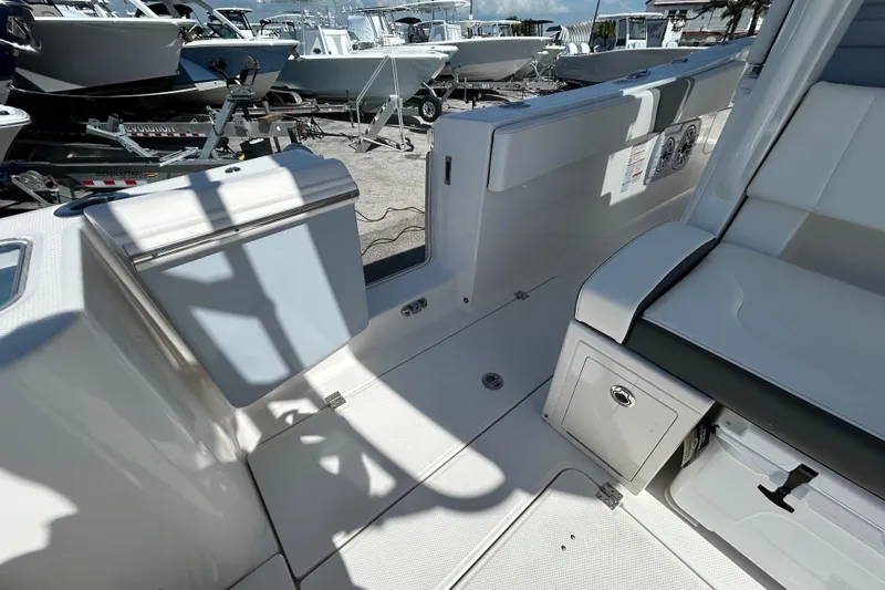  Yacht Photos Pics 2026 Robalo R360 Center Console boat interior with seating and storage compartments.