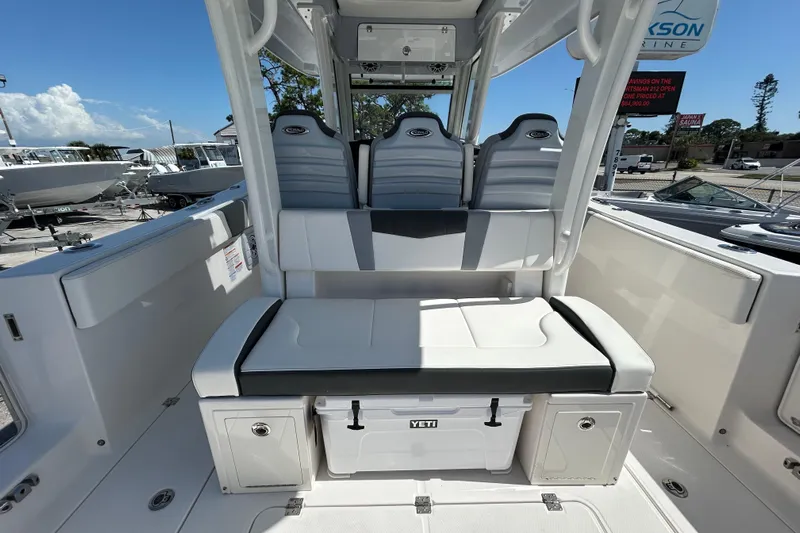  Yacht Photos Pics 2026 Robalo R360 Center Console boat interior with cushioned seating and storage compartments.