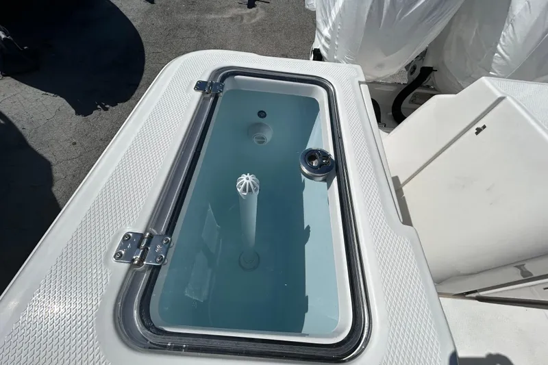  Yacht Photos Pics Livewell on 2026 Robalo R360 Center Console boat, featuring a clear lid and water circulation system.