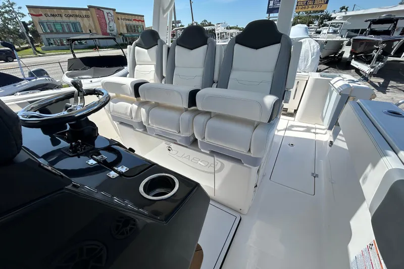 Yacht Photos Pics 2026 Robalo R360 Center Console boat interior with luxurious seating and steering wheel.