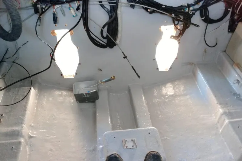 Piccopi Yacht Photos Pics Interior view of a 2007 Mano Marine 32.50 Sport boat engine compartment.