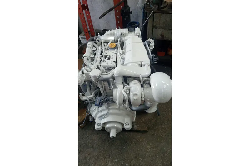 Piccopi Yacht Photos Pics Engine of 2007 Mano Marine 32.50 Sport boat, displayed in a workshop setting.