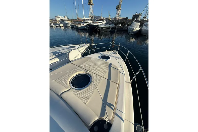 Piccopi Yacht Photos Pics 2007 Mano Marine 32.50 Sport yacht docked in a marina, featuring a sunbathing deck.