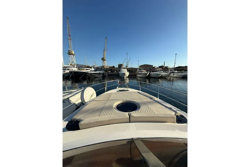 Piccopi Yacht Photos Pics 2007 Mano Marine 32.50 Sport yacht docked in a marina under clear blue sky.