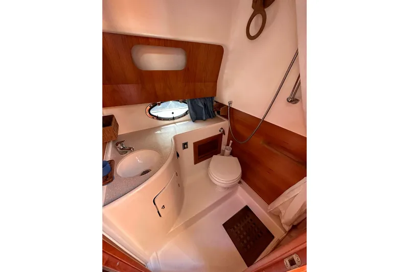 Piccopi Yacht Photos Pics 2007 Mano Marine 32.50 Sport boat bathroom with sink, toilet, and shower.