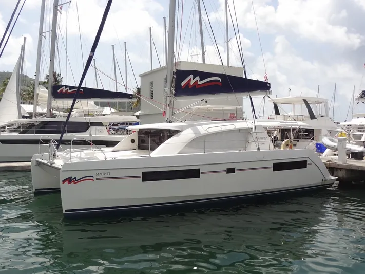 Maupiti Yacht Photos Pics 2019 Leopard 40 catamaran docked at a marina.