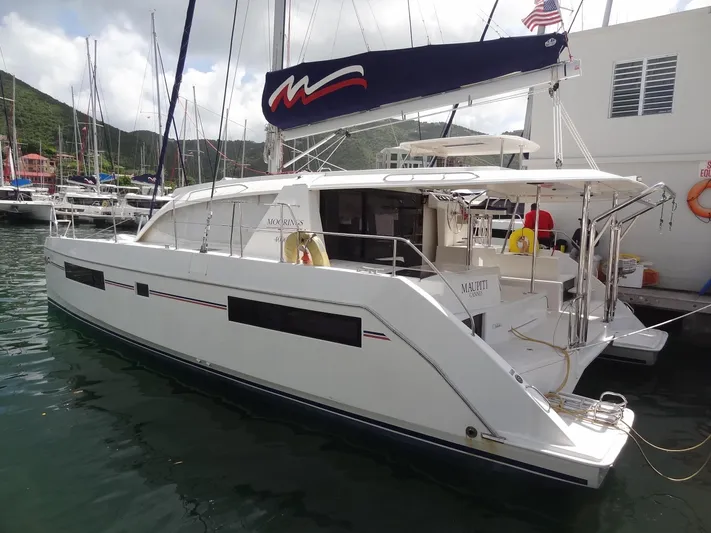 Maupiti Yacht Photos Pics 2019 Leopard 40 catamaran docked at a marina.