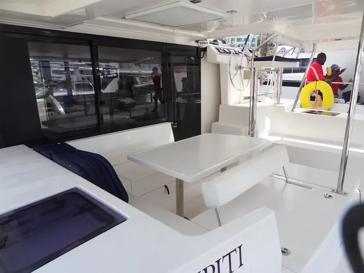 Maupiti Yacht Photos Pics 2019 Leopard 40 yacht interior with seating and dining area.