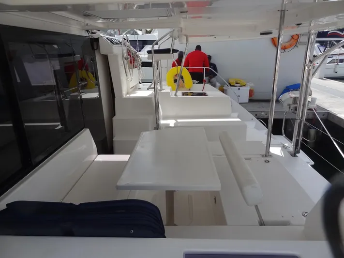 Maupiti Yacht Photos Pics 2019 Leopard 40 yacht interior with seating and table.