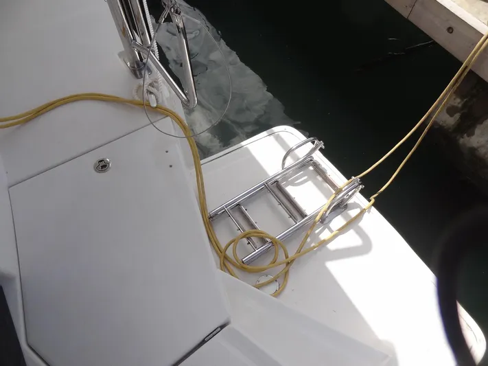 Maupiti Yacht Photos Pics Boarding ladder and deck of 2019 Leopard 40 catamaran with yellow rope.