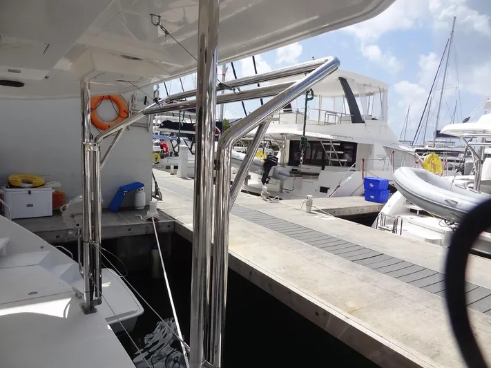 Maupiti Yacht Photos Pics 2019 Leopard 40 catamaran docked at a marina with other boats.