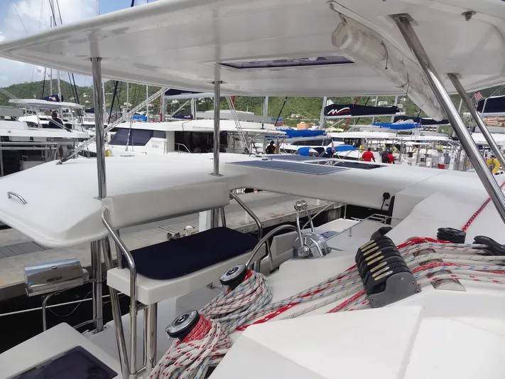 Maupiti Yacht Photos Pics 2019 Leopard 40 catamaran at marina, showcasing helm station and rigging.