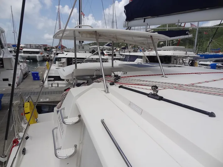 Maupiti Yacht Photos Pics 2019 Leopard 40 catamaran docked at a marina with other boats.