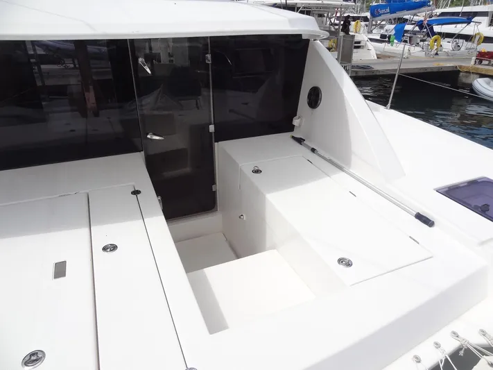Maupiti Yacht Photos Pics 2019 Leopard 40 catamaran cockpit with storage compartments and seating.