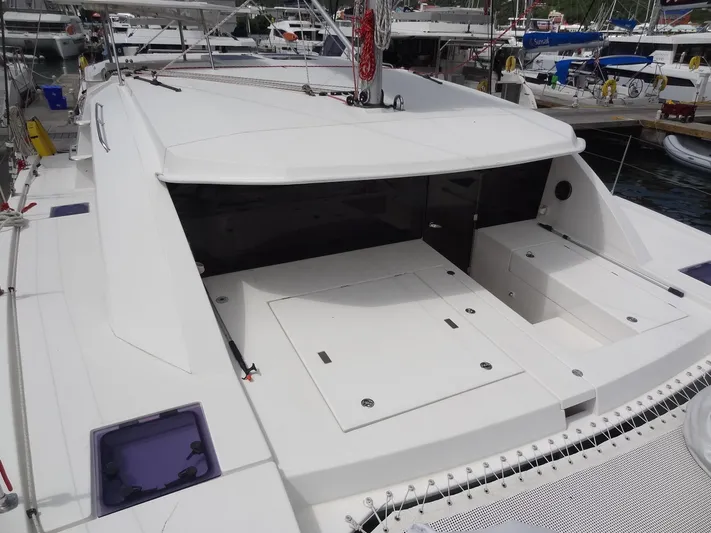 Maupiti Yacht Photos Pics 2019 Leopard 40 catamaran docked, showing spacious deck and storage compartments.