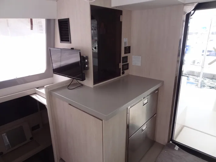 Maupiti Yacht Photos Pics 2019 Leopard 40 yacht interior with modern kitchen and small TV.