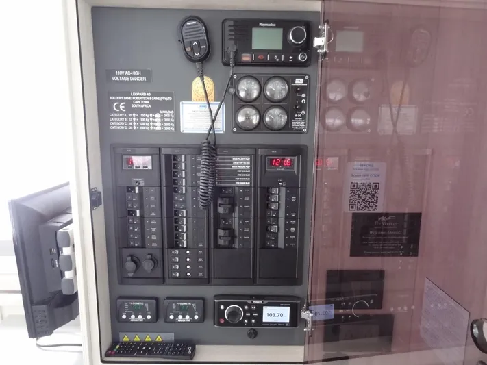 Maupiti Yacht Photos Pics 2019 Leopard 40 control panel with radio, gauges, and switches.