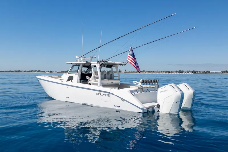 Vandy Yacht Photos Pics 2024 Solace 41 CS boat on calm blue water, featuring dual Mercury engines.