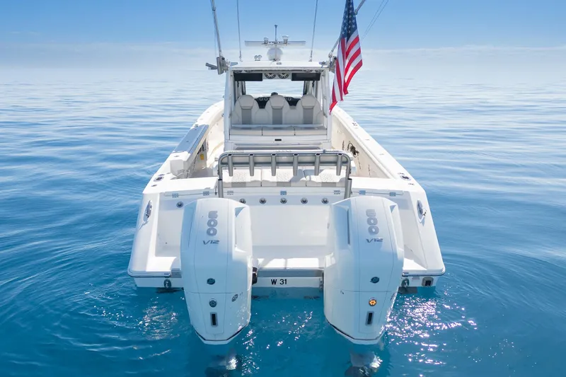 Vandy Yacht Photos Pics 2024 Solace 41 CS boat with dual engines on calm ocean water.