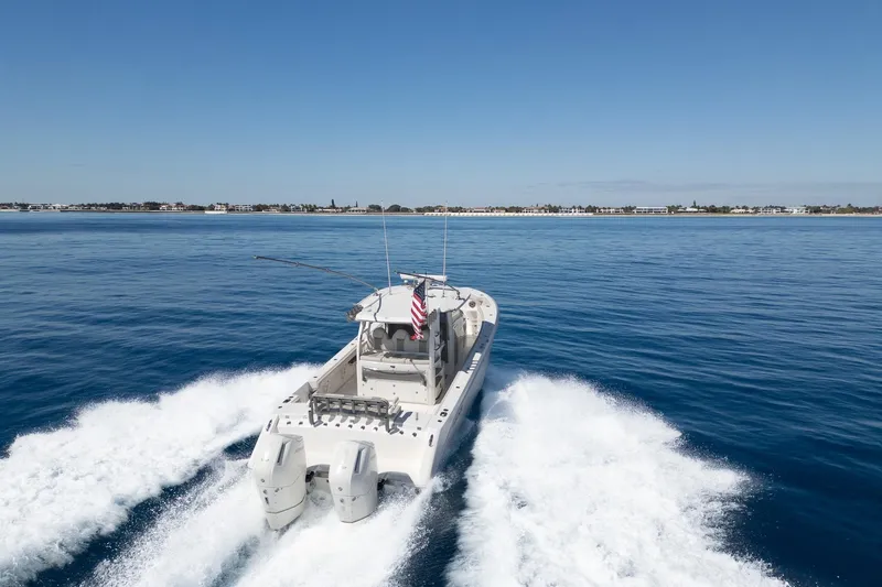 Vandy Yacht Photos Pics 2024 Solace 41 CS boat cruising on open water with clear blue sky.