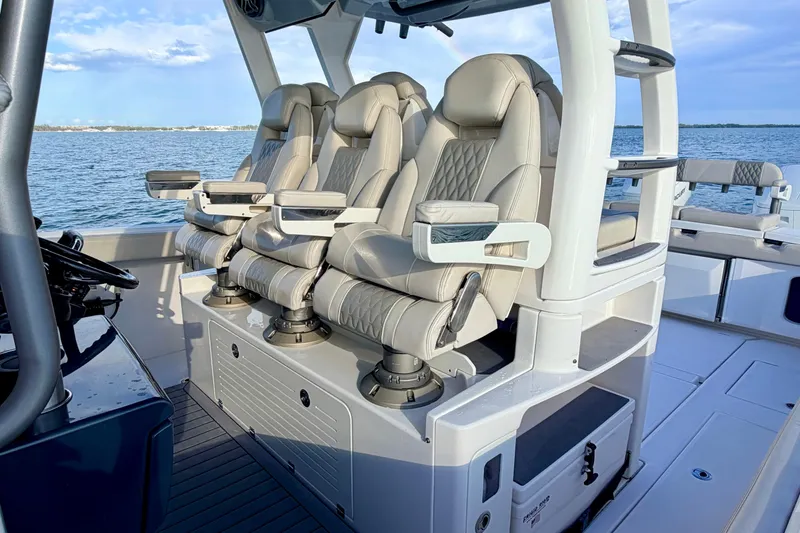 Vandy Yacht Photos Pics Luxurious seating on 2024 Solace 41 CS boat, featuring ergonomic design and ocean backdrop.