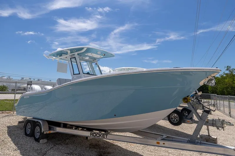  Yacht Photos Pics 2026 Sea Fox 268 Commander boat on trailer under clear blue sky.