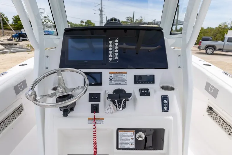  Yacht Photos Pics 2026 Sea Fox 268 Commander boat dashboard with steering wheel and navigation controls.