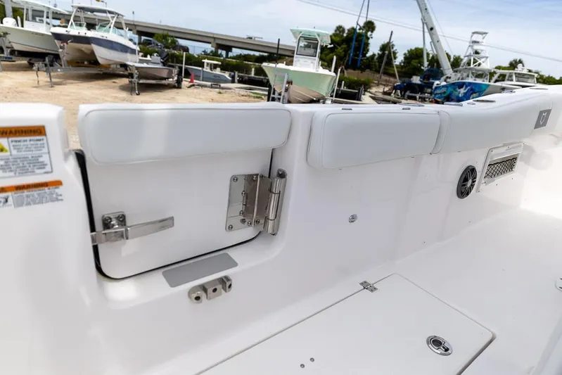  Yacht Photos Pics 2026 Sea Fox 268 Commander boat interior with open hatch and docked boats in background.