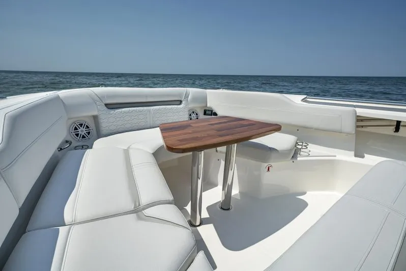 Str8to Yacht Photos Pics Manufacturer Provided Image: Luxurious seating area on 2025 Tiara Yachts 43 LS, featuring elegant white upholstery and ocean view.
