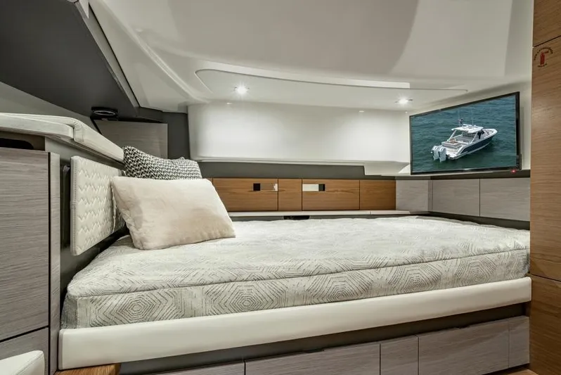 Str8to Yacht Photos Pics Manufacturer Provided Image: Luxurious interior cabin of 2025 Tiara Yachts 43 LS with modern bedding and TV.