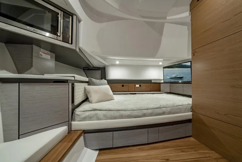 Str8to Yacht Photos Pics Manufacturer Provided Image: Luxurious interior of 2025 Tiara Yachts 43 LS, featuring a cozy bed and modern design.