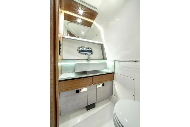 Str8to Yacht Photos Pics Manufacturer Provided Image: Luxurious bathroom interior of 2025 Tiara Yachts 43 LS, featuring modern sink and elegant design.