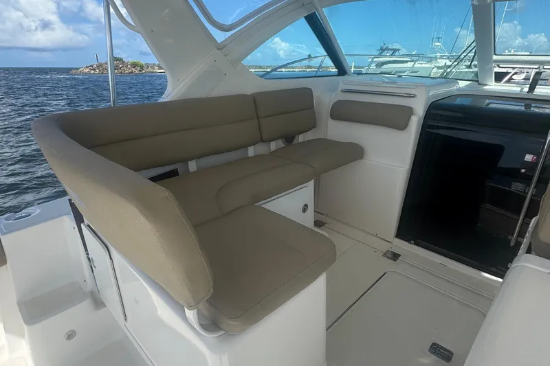  Yacht Photos Pics Interior of 2005 Tiara Yachts 3200 Open with beige seating and ocean view.