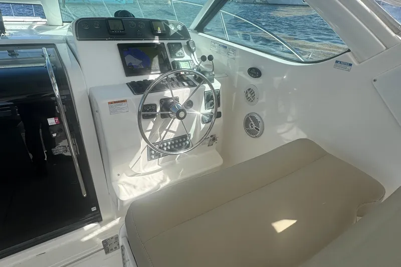  Yacht Photos Pics 2005 Tiara Yachts 3200 Open helm with steering wheel and navigation equipment.