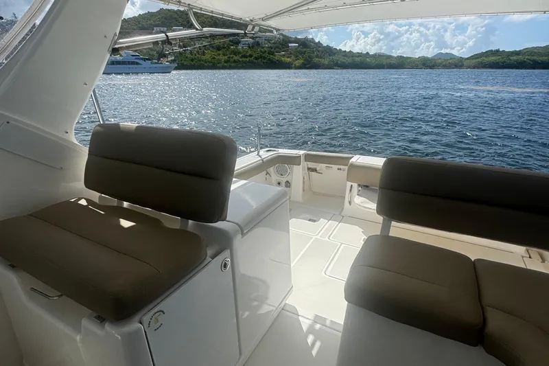  Yacht Photos Pics 2005 Tiara Yachts 3200 Open interior with seating, overlooking scenic water and hills.