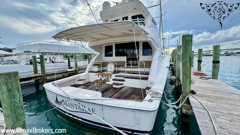  Yacht Photos Pics Luxury Bertram 800 yacht docked, 2011 model, featuring spacious deck and elegant design.