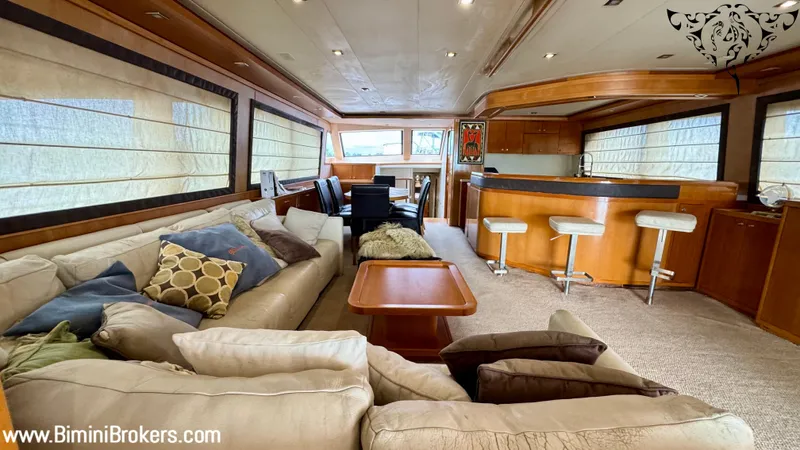  Yacht Photos Pics Luxurious interior of a 2011 Bertram 800 yacht with plush seating and modern bar area.