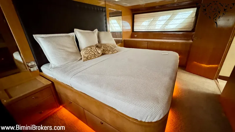  Yacht Photos Pics Luxurious bedroom interior of 2011 Bertram 800 yacht with ambient lighting.