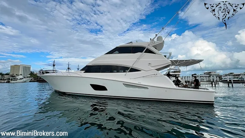  Yacht Photos Pics Luxury 2011 Bertram 800 yacht docked at marina under blue sky.