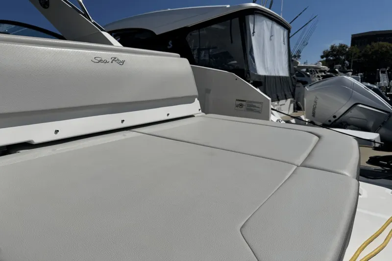  Yacht Photos Pics 2023 Sea Ray 320 Sundancer boat with cushioned seating and sleek design.