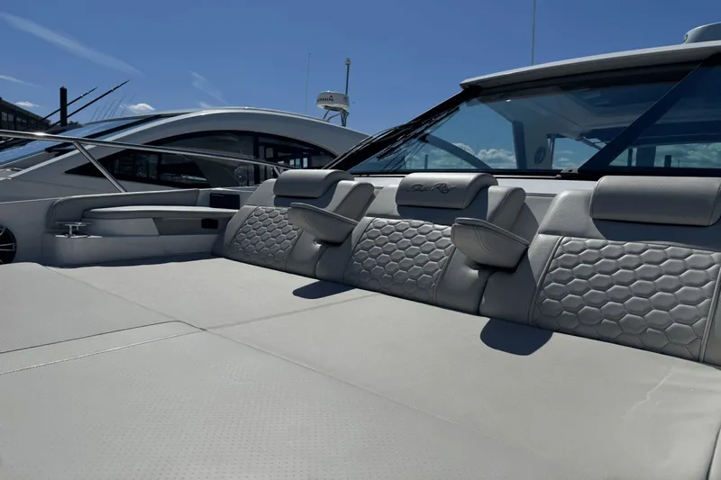  Yacht Photos Pics 2023 Sea Ray 320 Sundancer luxury boat interior with sleek seating design.
