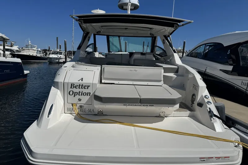  Yacht Photos Pics 2023 Sea Ray 320 Sundancer boat docked at marina, rear view, labeled "A Better Option."