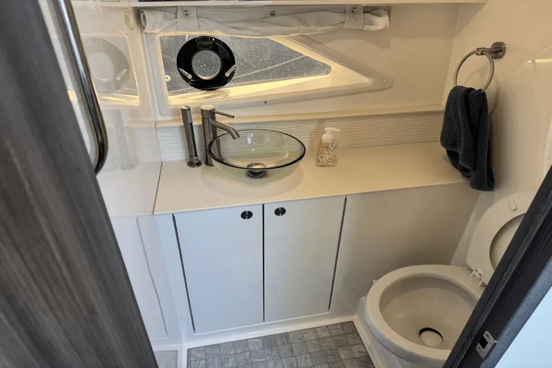 Yacht Photos Pics 2023 Sea Ray 320 Sundancer bathroom with modern sink and toilet.
