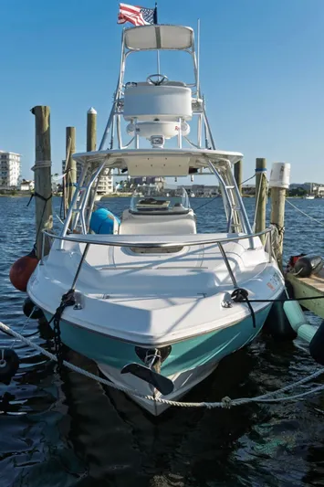  Yacht Photos Pics 2006 Boston Whaler 320 Outrage Cuddy Cabin docked at marina, front view.