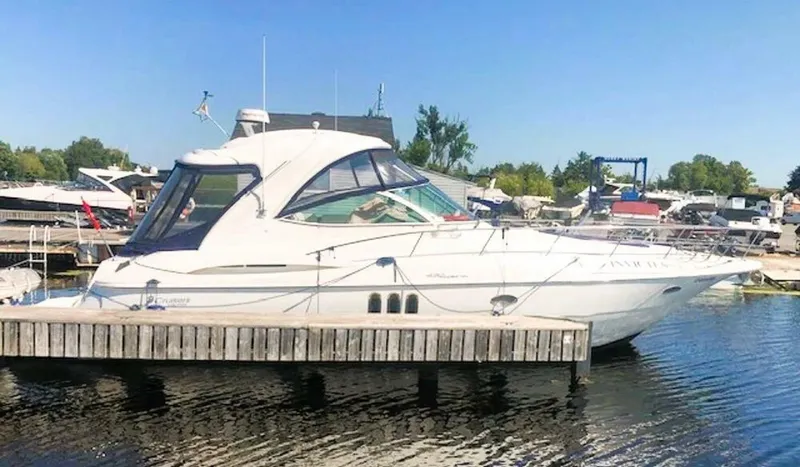  Yacht Photos Pics 2006 Cruisers Yachts 420 Express docked at a marina on a sunny day.