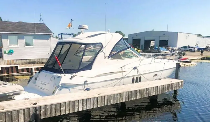  Yacht Photos Pics 2006 Cruisers Yachts 420 Express docked at a marina under clear skies.