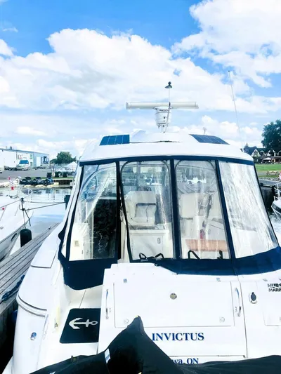  Yacht Photos Pics 2006 Cruisers Yachts 420 Express docked under a bright blue sky.