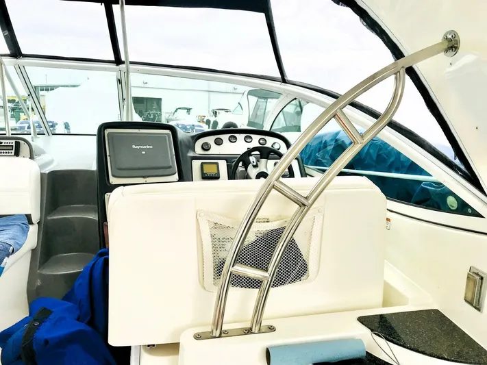  Yacht Photos Pics 2006 Cruisers Yachts 420 Express helm with modern navigation equipment and sleek design.