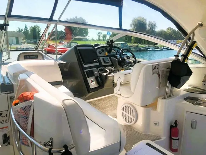  Yacht Photos Pics 2006 Cruisers Yachts 420 Express cockpit with modern controls and comfortable seating.